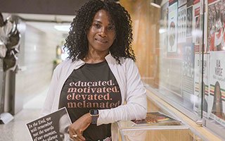 Registered Nurse Macrina Valcin showcases her Black History Month display at the General Campus.
